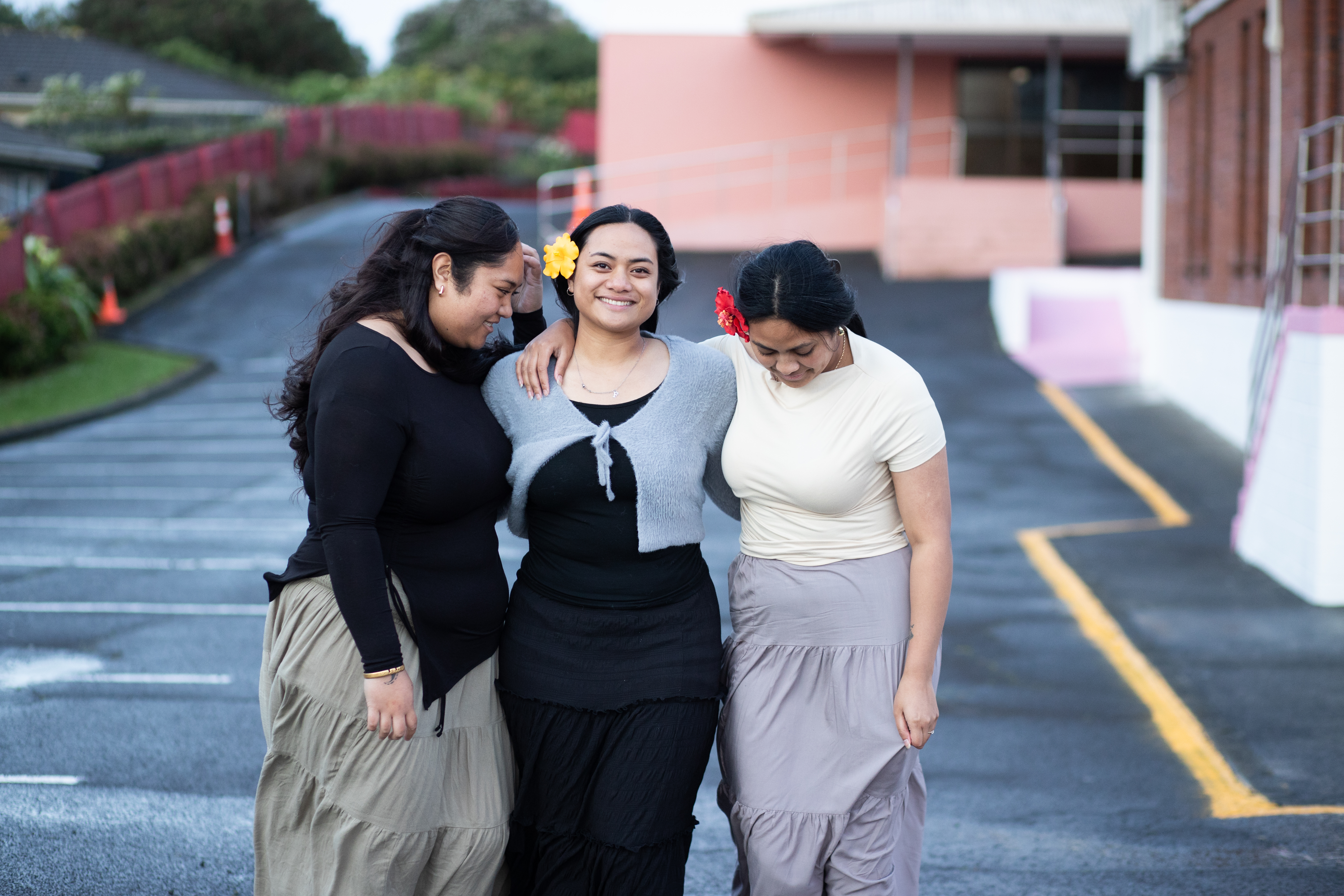 Three Church Youth Group girls outside in the carpark.