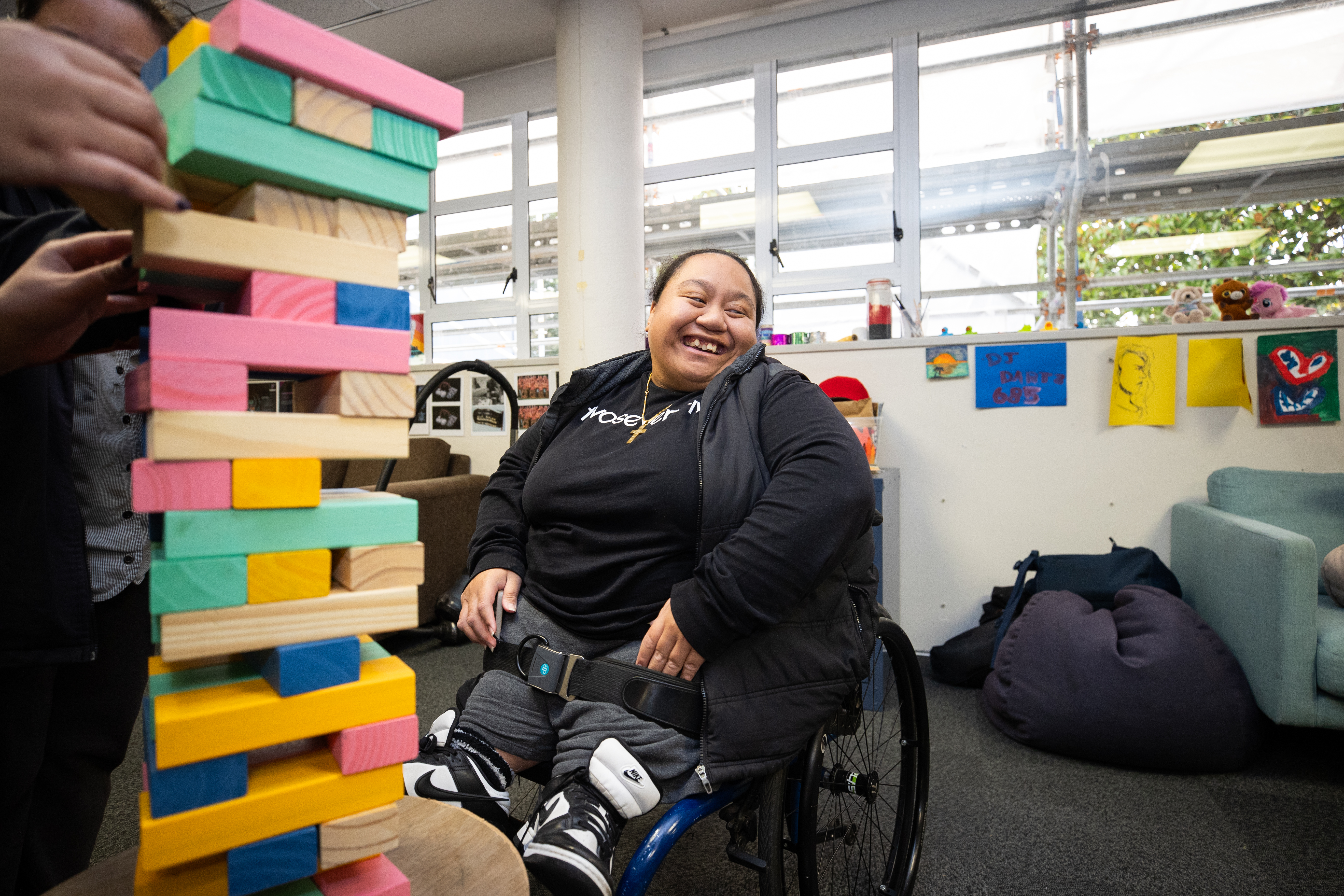 Disabled person playing a game in a rec room