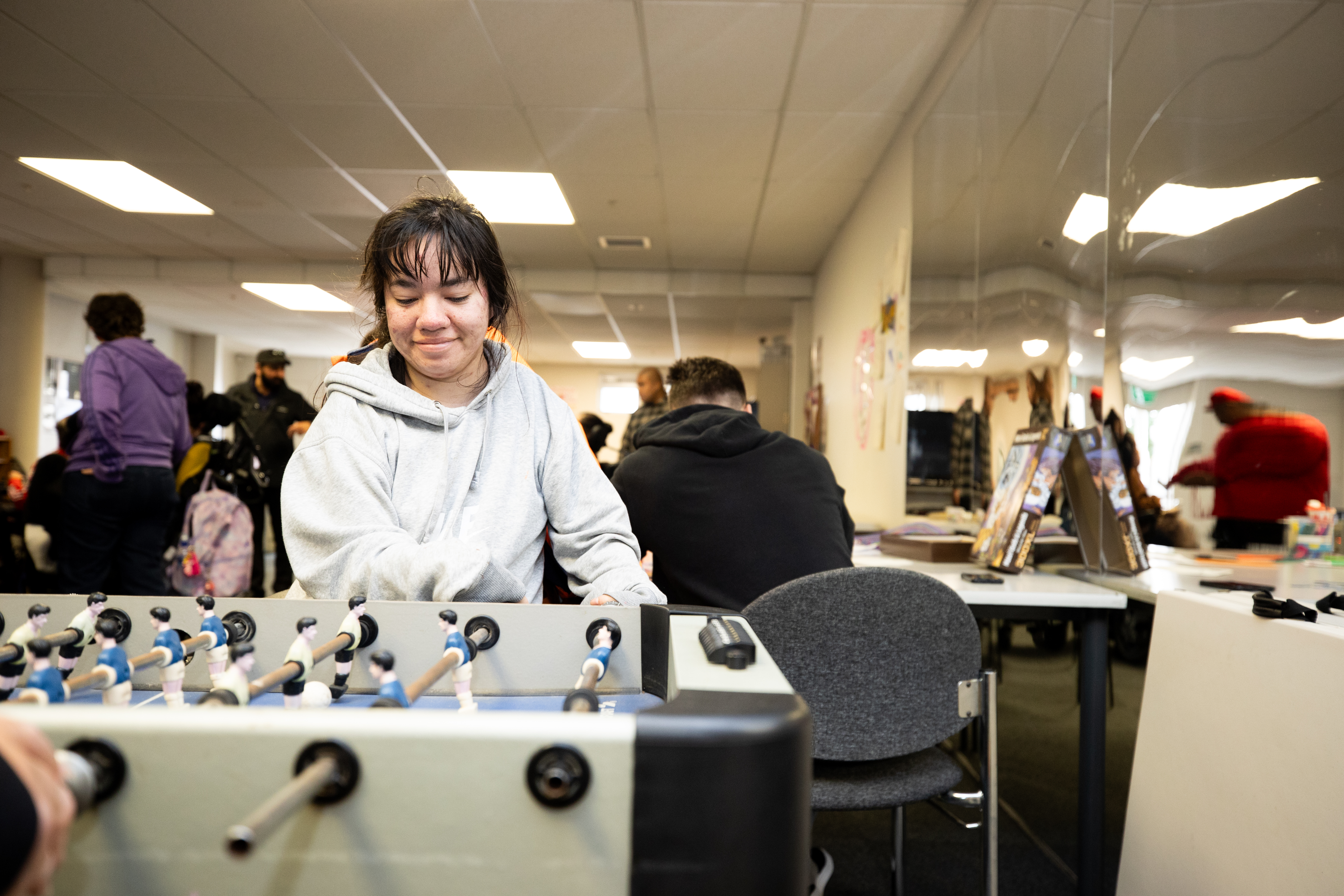 Disabled female playing a game in a rec room