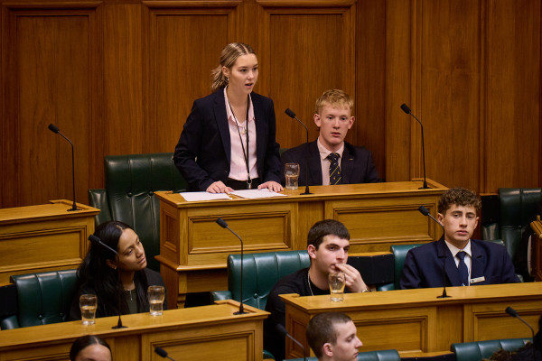 Neeve is pictured mid-debate in the Parliament Debate Chamber in Wellington