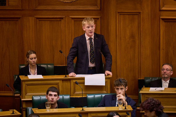 Daniel Matthew photographed mid-debate from the Debating Chamber at Parliament