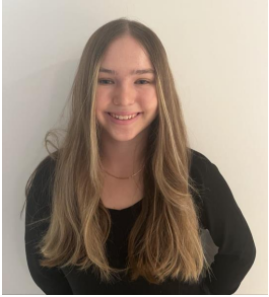 Image of Youth MP Ruby Love-Smith, smiling in front of a plain white background